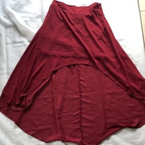 Red skirt short front and long in back.